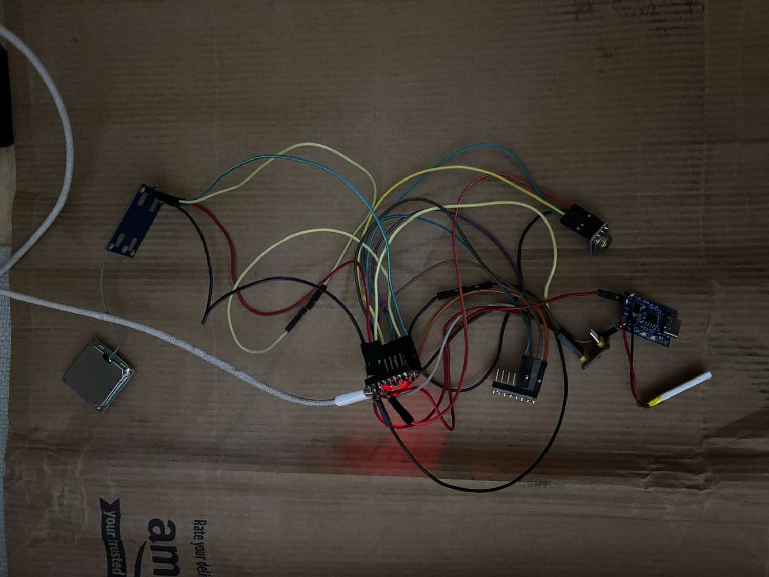 A close-up of hands working on the electronics